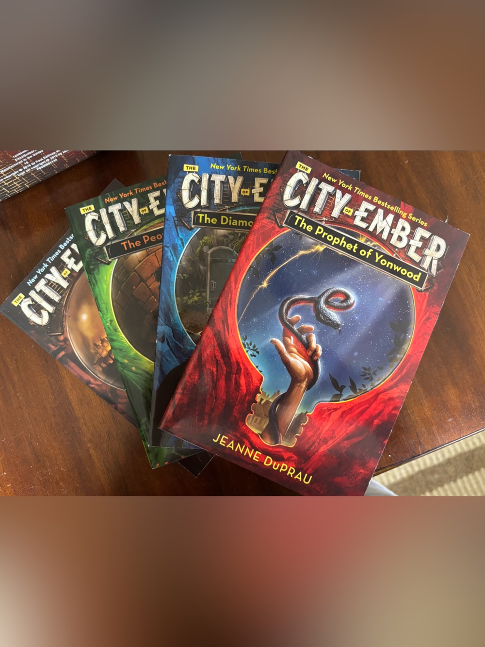 City of Ember Paperback Set - Red, Blue, Green, Brown Covers